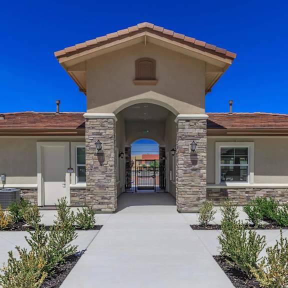 the entrance to a building with a walkway and columns at Edgewater, Pittsburg, CA 94565
