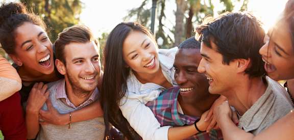 A group of people huddled together outdoors.