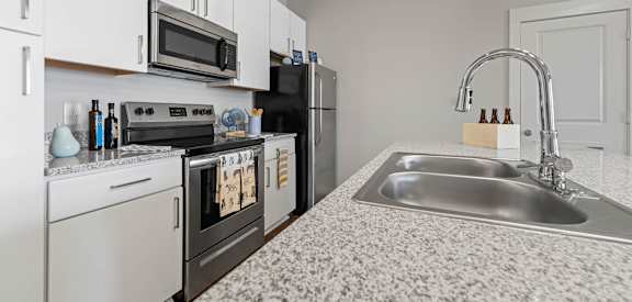 a kitchen with granite counter tops and a sink