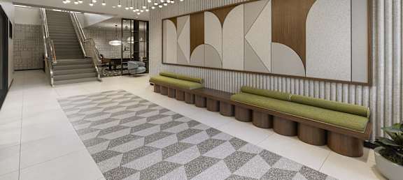 A long hallway with a bench and a wall with a design on it.