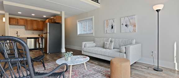 a living room with a couch and a table at Fox Run Apartments, St. Charles, Illinois
