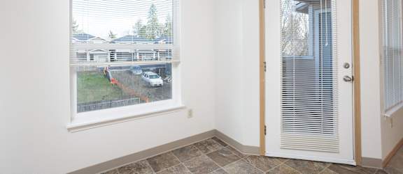A room with a window and a door.
