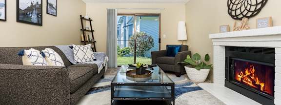 Copper Ridge Apartments in Renton, Washington Model Living Room with Fireplace and Private Patio
