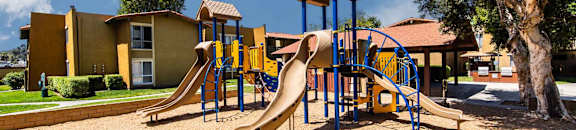 Community playground with slides and climbing bars at CASA GRANDE APARTMENT HOMES, Cypress