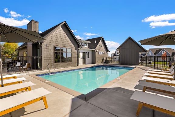 outdoor pool with lounge chairs