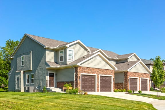 A house with attached garages  at Prairie Pines Townhomes, Kansas