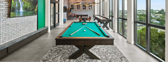 a pool table in the clubhouse at ascend at woodbury new luxury apartments in woodbury m