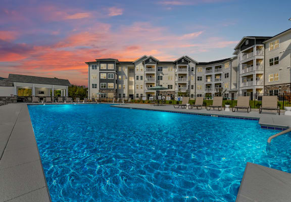 Sunset look at the outdoor swimming pool at The Station at Brighton apartments in Grovetown, GA