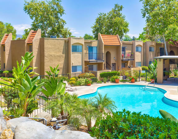 Sparkling pool at Woodlake Apartments In Escondido, CA offers 1 & 2 bedroom apartments