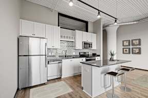 Kitchen with White Cabinetry and Stainless Steel Appliances