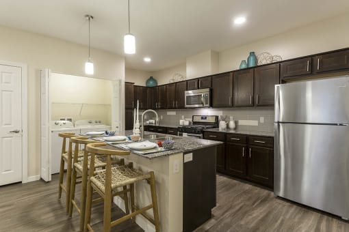 Kitchen with wooden cabinets at The View at Horizon Ridge, Henderson, NV