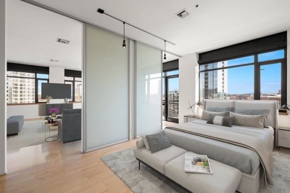 a bedroom with a bed and a window