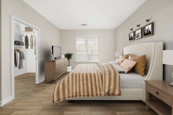a bedroom with a bed and a dresser