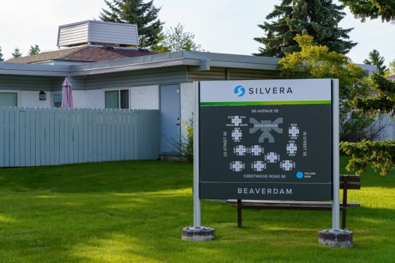 a sign in front of a house