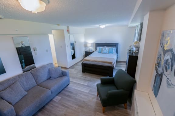 a view of the living room and bedroom in a two bedroom apartment