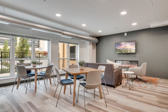 a dining room with a table and chairs and a fireplace