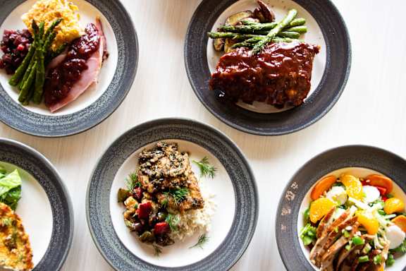 a collection of plates of food on a table