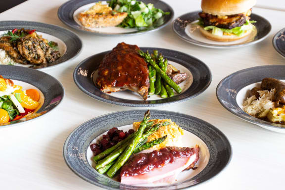 a table with a variety of plates of food on it