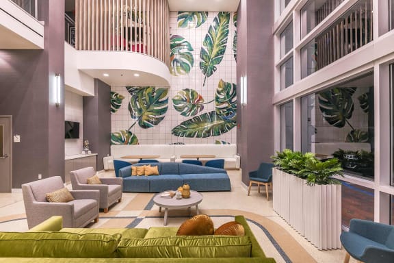 a rendering of a hotel lobby with purple walls and green couches and chairs at Paramount on Lake Eola, Orlando, 32801