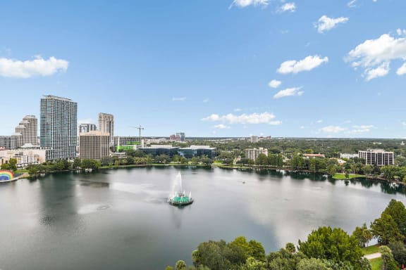a city with a sailboat in the middle of a lake at Paramount on Lake Eola, Orlando