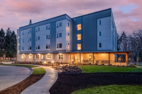 the residences at city center apartments exterior at dusk