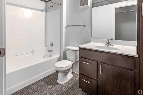 a bathroom with a sink toilet and a bath tub
