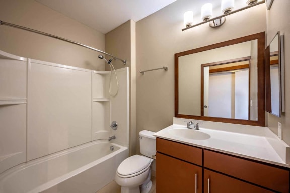 a bathroom with a sink toilet and a shower