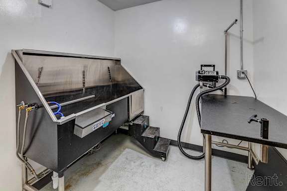 the inside of a room with a stove and a table