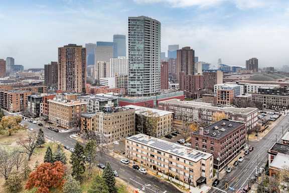 A cityscape with a mix of modern and older buildings.