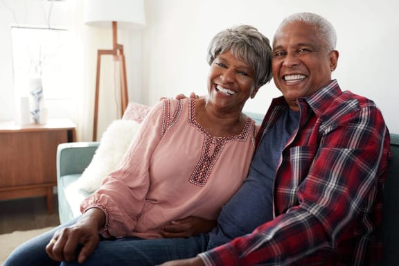 Senior Lifestyle_Couple Smiling - Couch
