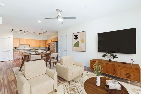 Living Room With TV at The Promenade, McDonough, GA