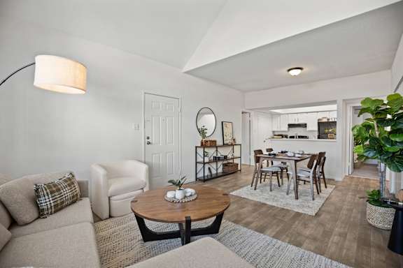 A living room with a couch, chair, and coffee table.