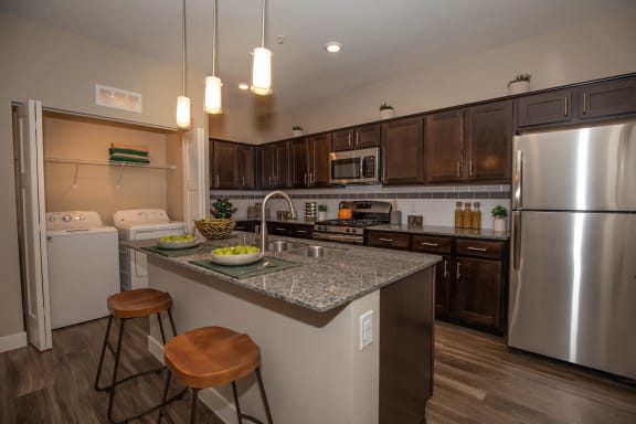 Kitchen with cabinets at Level 25 at Cactus by Picerne, Las Vegas