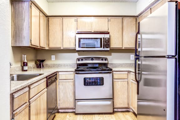 Bright spacious kitchens with ample storage at Trinity Square Apartments