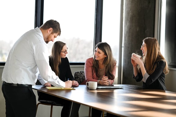 a group of people sitting around a table