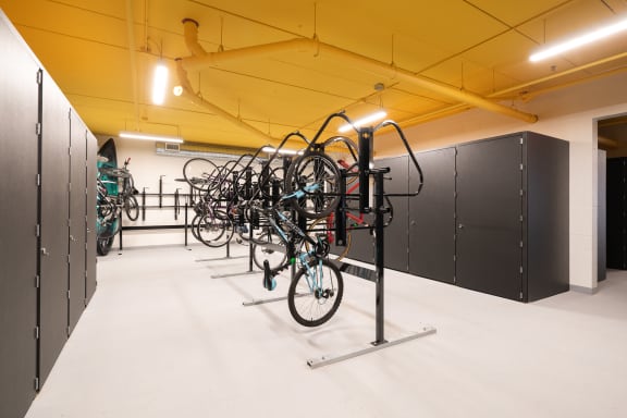the bike rack in the center of the building is filled with bikes