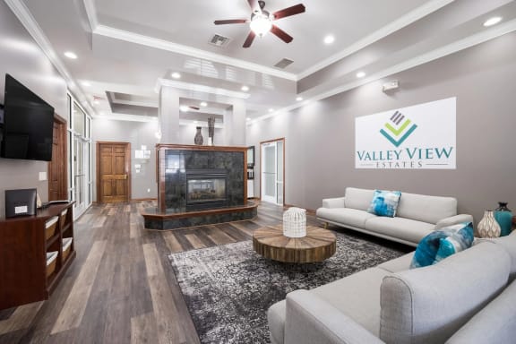a living room filled with furniture and a fire place