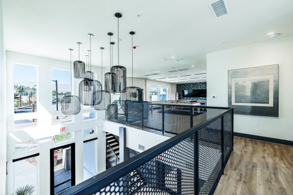 a large kitchen with a long counter and a staircase at BASE APARTMENT HOMES, LAS VEGAS, NV