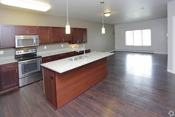 an open floor plan with a kitchen and living room