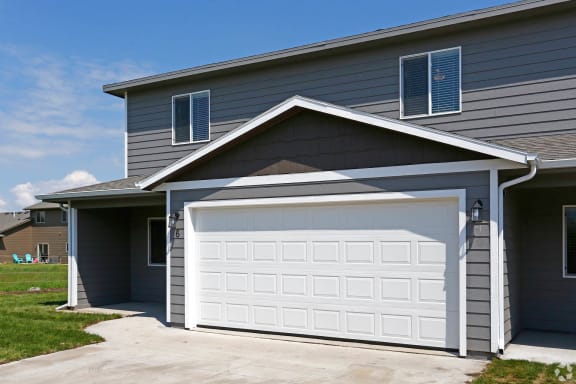 a garage door in front of a house