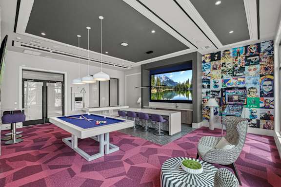 a game room with a pool table and a tv at Altis Grand Kendall, Florida, 33186