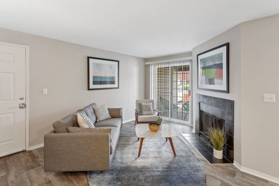 Alvista 23 Apartment Homes Model Living Room with Fireplace and Private Patio