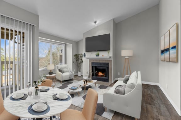 Aspire Apartments at Mountlake Terrace in Washington Model Living Room with Fireplace and Dining Area