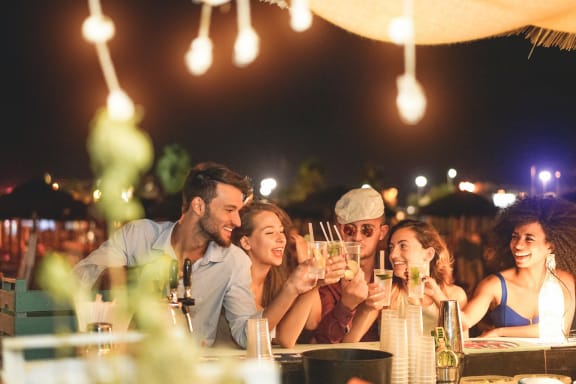 Group of Friends Smiling Having Drinks Together