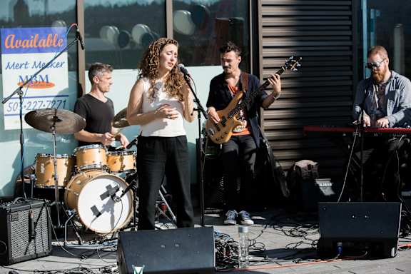 a group of people playing music on a stage