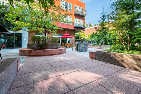 Koi Apartments in Ballard, Washington Exterior and Courtyard with BBQ's and Seating at Koi Apartments, Seattle, Washington