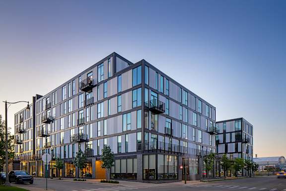 A modern building with a lot of windows is shown.