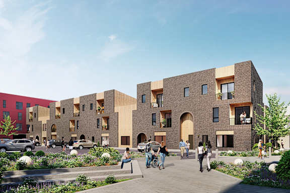 A modern building with a courtyard and people walking around.