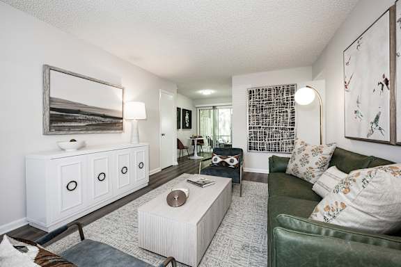 A kitchen with a stainless steel refrigerator, microwave, oven, and dishwasher.