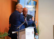 Thumbnail 4 of 16 - Two men hug at a Copper.io event.